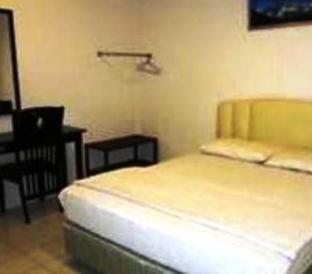 Mendu Inn Kuching Habitación foto