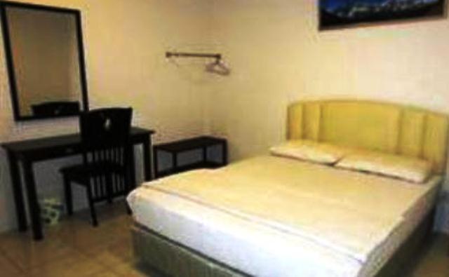 Mendu Inn Kuching Habitación foto